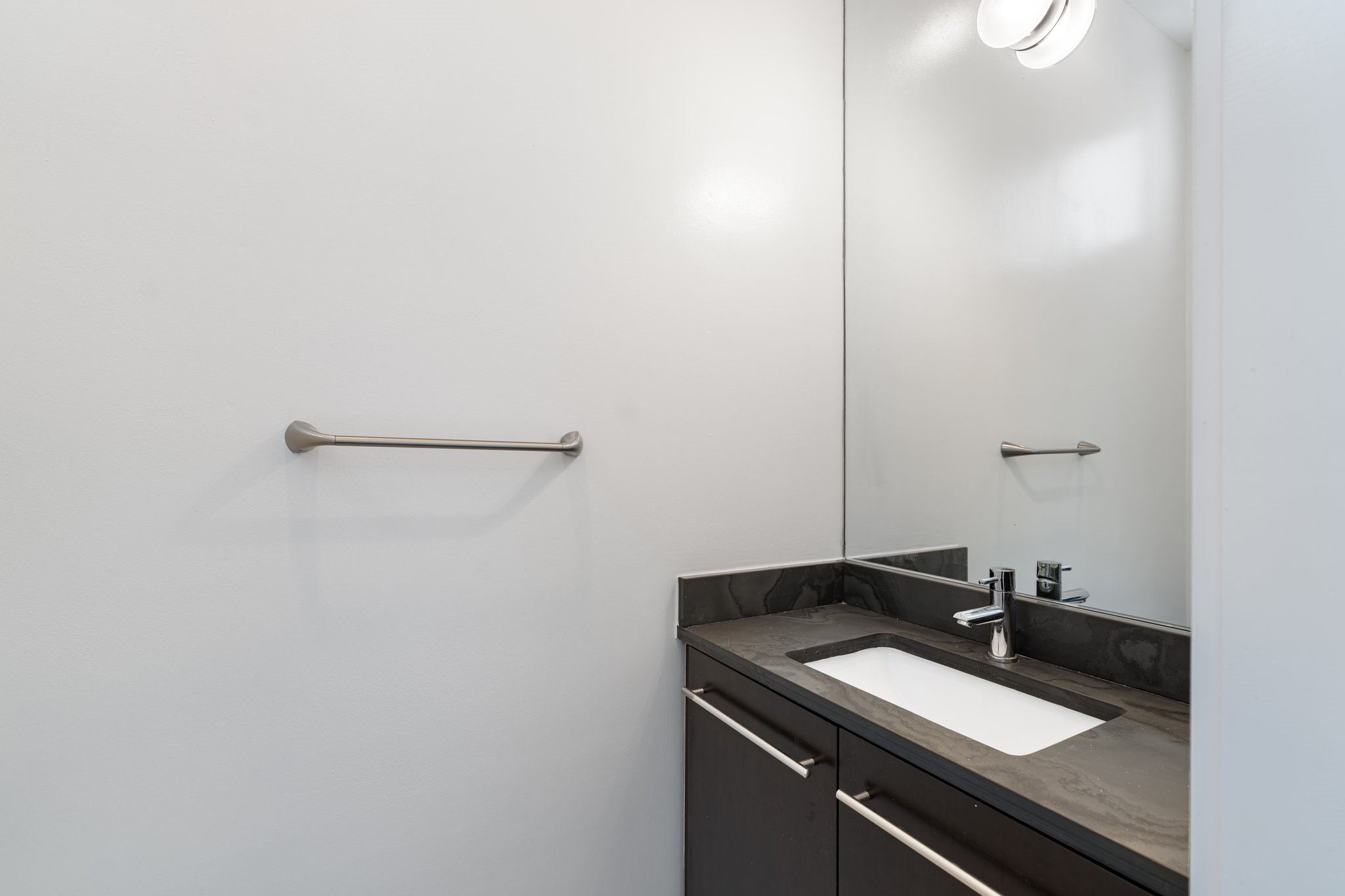 1728 Michigan Street, Unit B Houston, TX 77006 - Photo 10 of 24 A powder bath conveniently sits just off of the living area on the second floor.