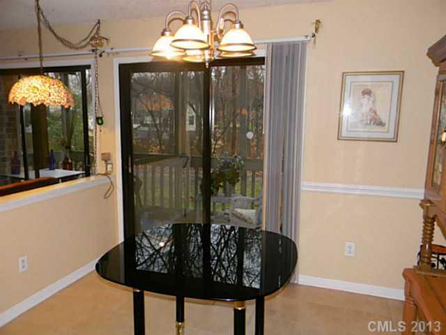 11006 Running Ridge Road, Unit 8441 Charlotte, NC 28226 - Photo 4 of 12 a front view of a house with garden