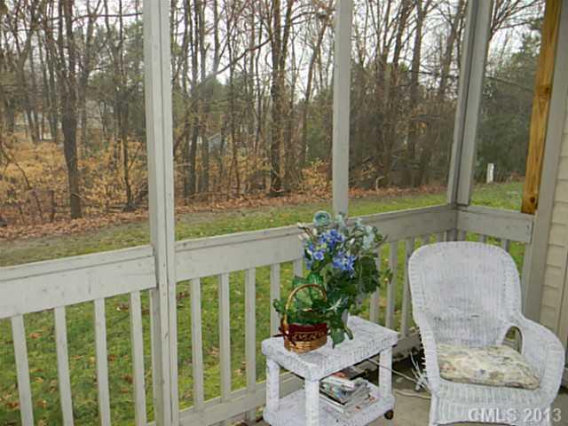 11006 Running Ridge Road, Unit 8441 Charlotte, NC 28226 - Photo 6 of 12 a view of a porch with furniture and garden