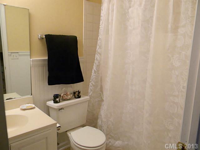 11006 Running Ridge Road, Unit 8441 Charlotte, NC 28226 - Photo 8 of 12 a bathroom with a toilet and a sink