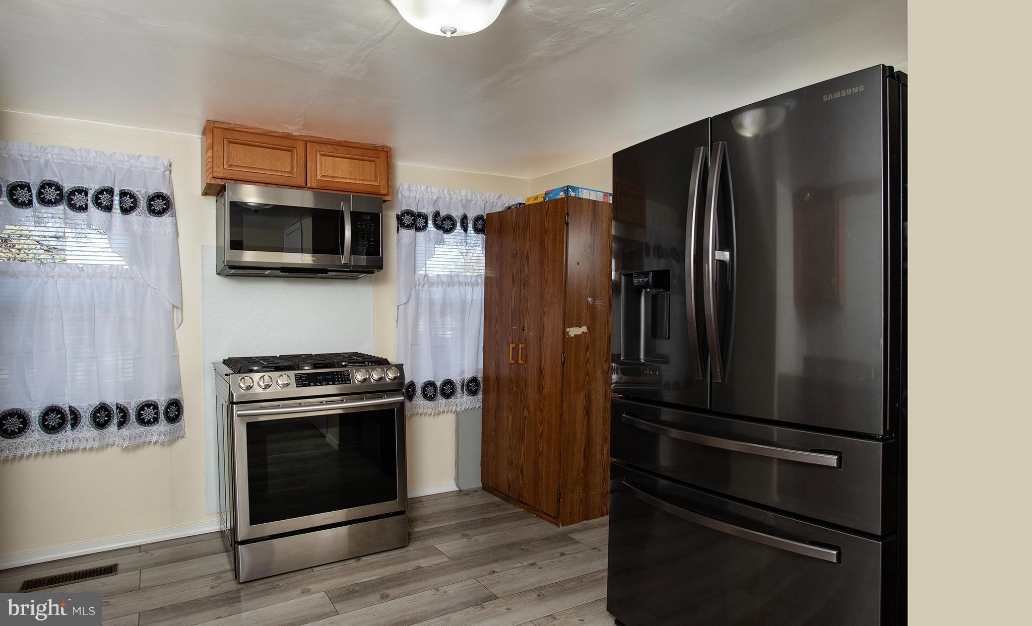 1102 Rana Villa Avenue Camp Hill, PA 17011 - Photo 16 of 41 a kitchen with a refrigerator stove and microwave