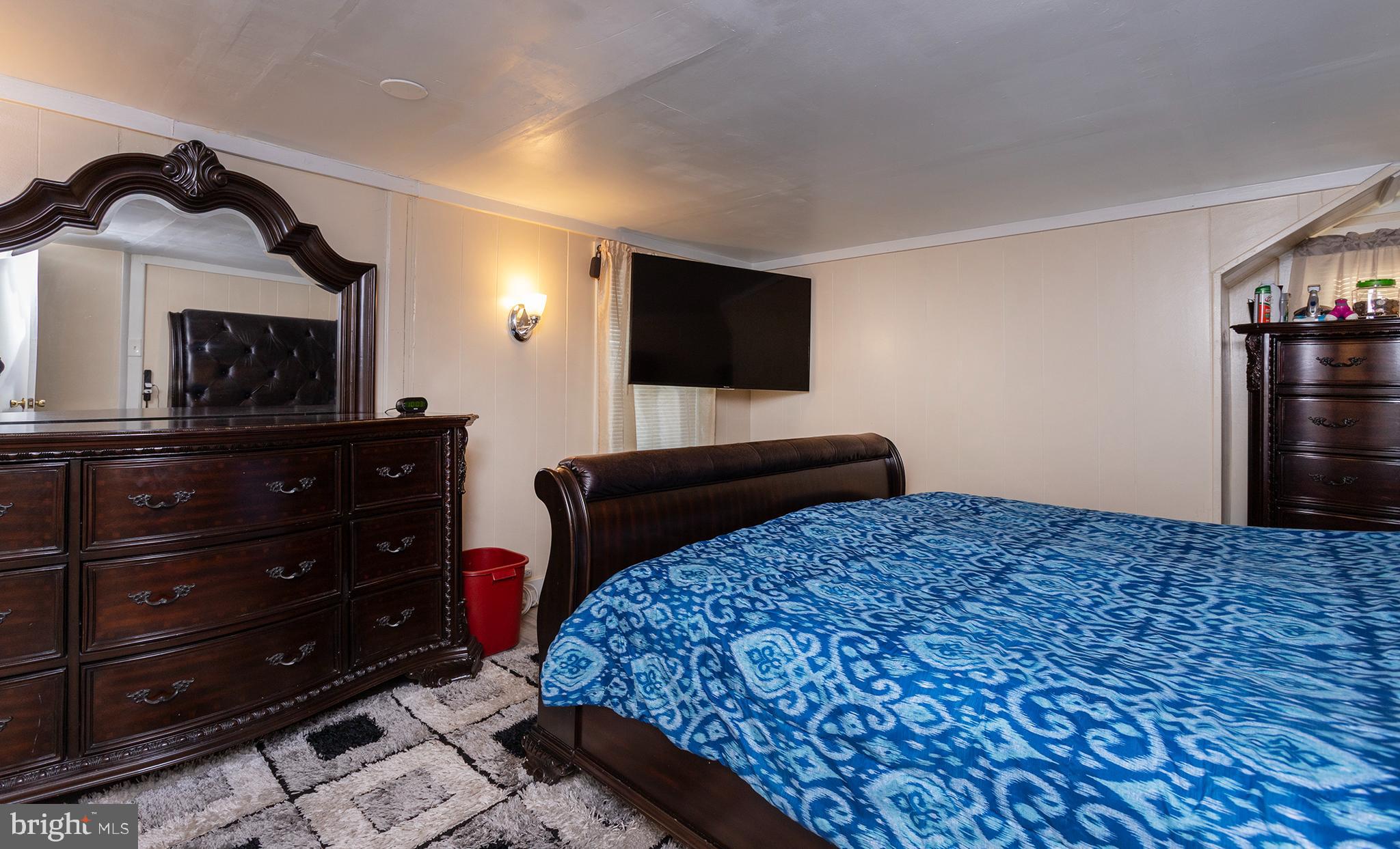 1102 Rana Villa Avenue Camp Hill, PA 17011 - Photo 22 of 41 a bedroom with a bed and a flat screen tv