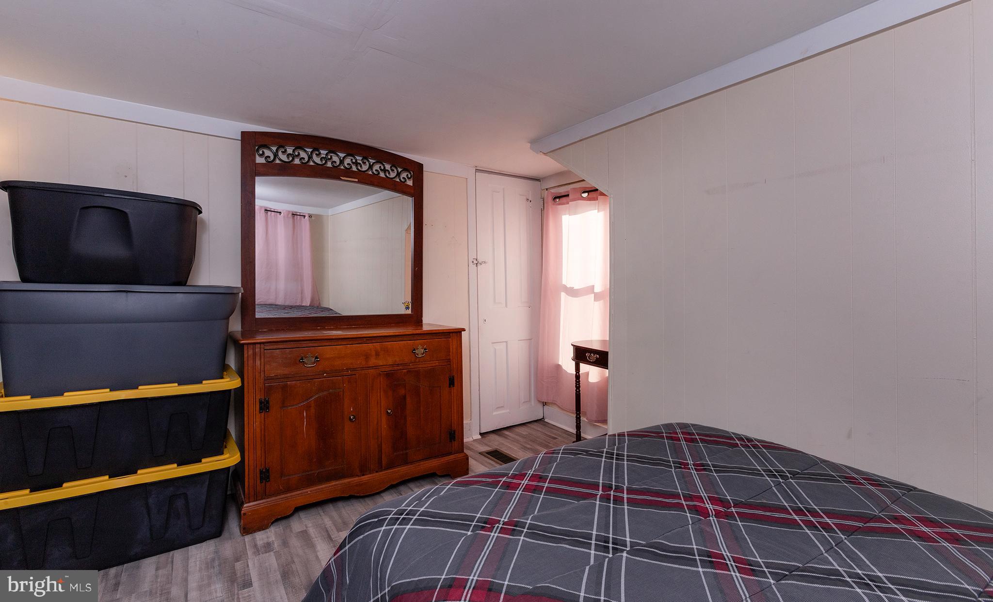 1102 Rana Villa Avenue Camp Hill, PA 17011 - Photo 25 of 41 a bedroom with a bed and dresser