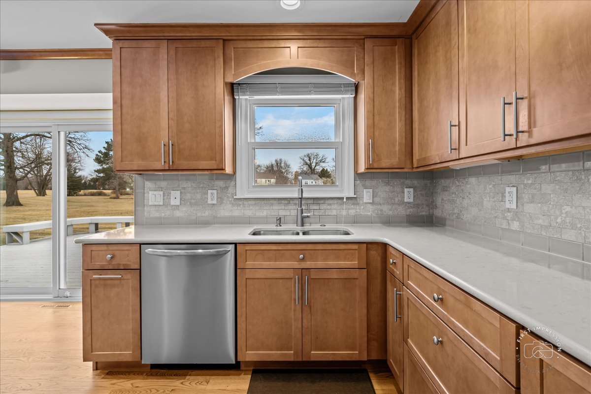 32 Dunham Place St. Charles, IL 60174 - Photo 14 of 56 a kitchen with stainless steel appliances granite countertop a sink and cabinets