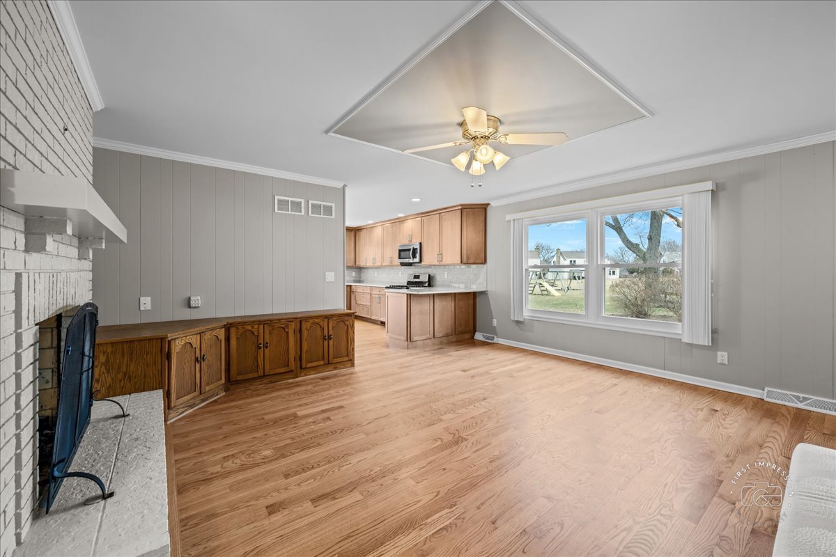 32 Dunham Place St. Charles, IL 60174 - Photo 20 of 56 a view of a kitchen with a sink microwave and outdoor space