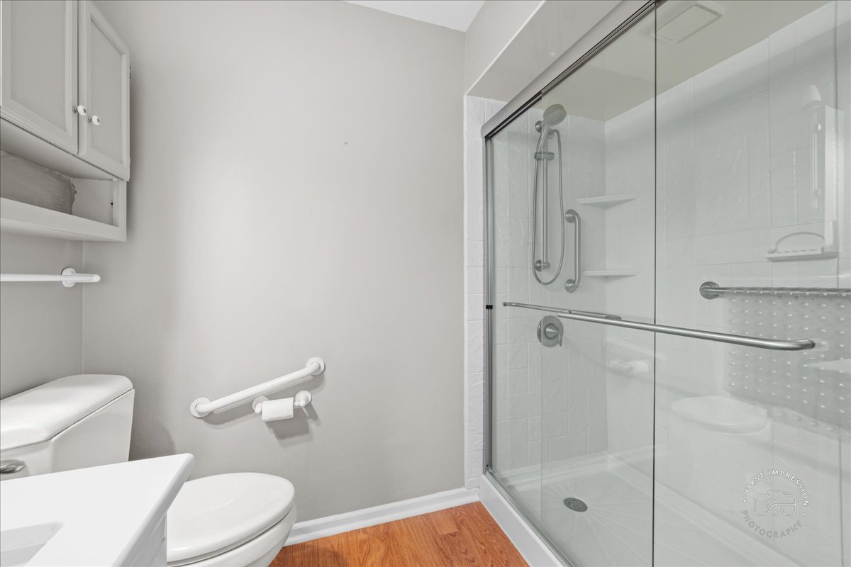 32 Dunham Place St. Charles, IL 60174 - Photo 26 of 56 a bathroom with a shower a toilet and a sink