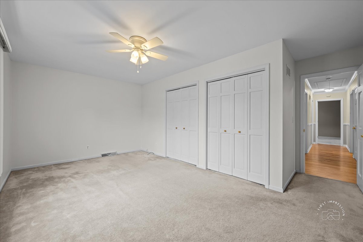32 Dunham Place St. Charles, IL 60174 - Photo 28 of 56 a view of a chandelier fan and entryway