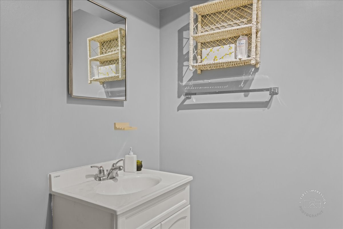 32 Dunham Place St. Charles, IL 60174 - Photo 45 of 56 a bathroom with a sink and a window