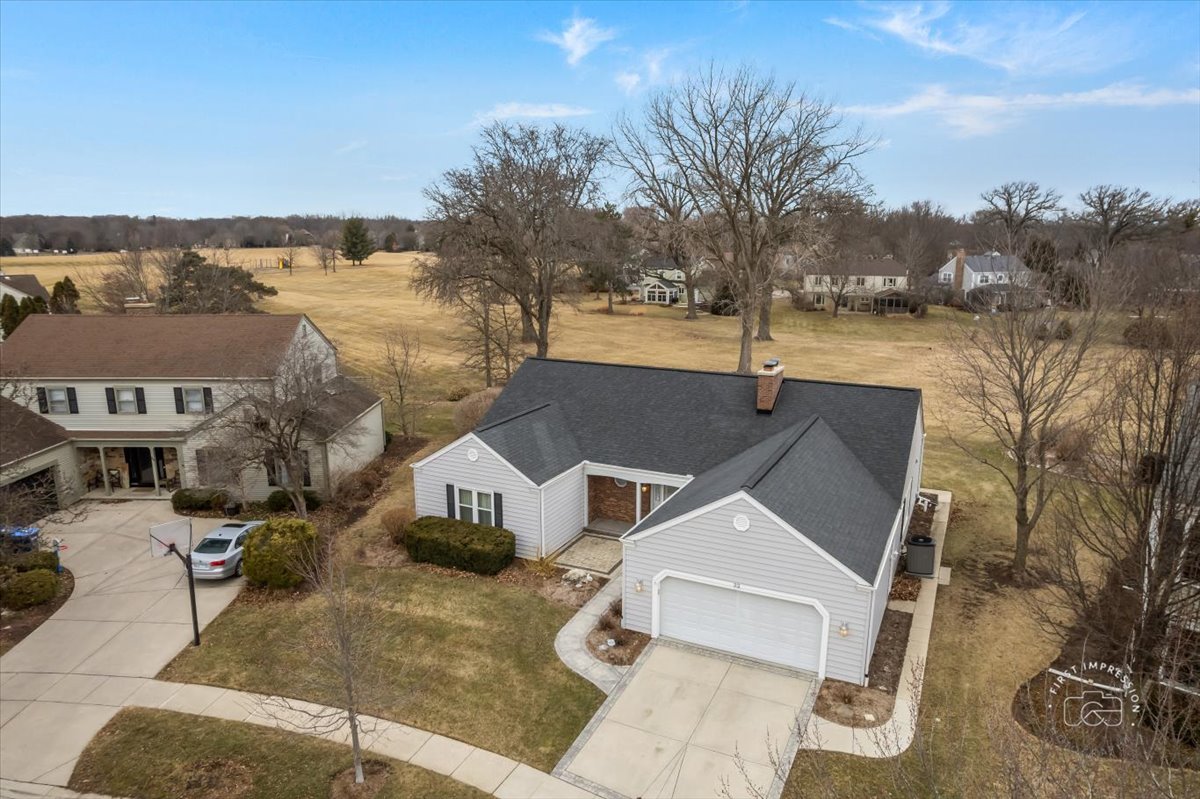 32 Dunham Place St. Charles, IL 60174 - Photo 48 of 56 a front view of a house with a yard