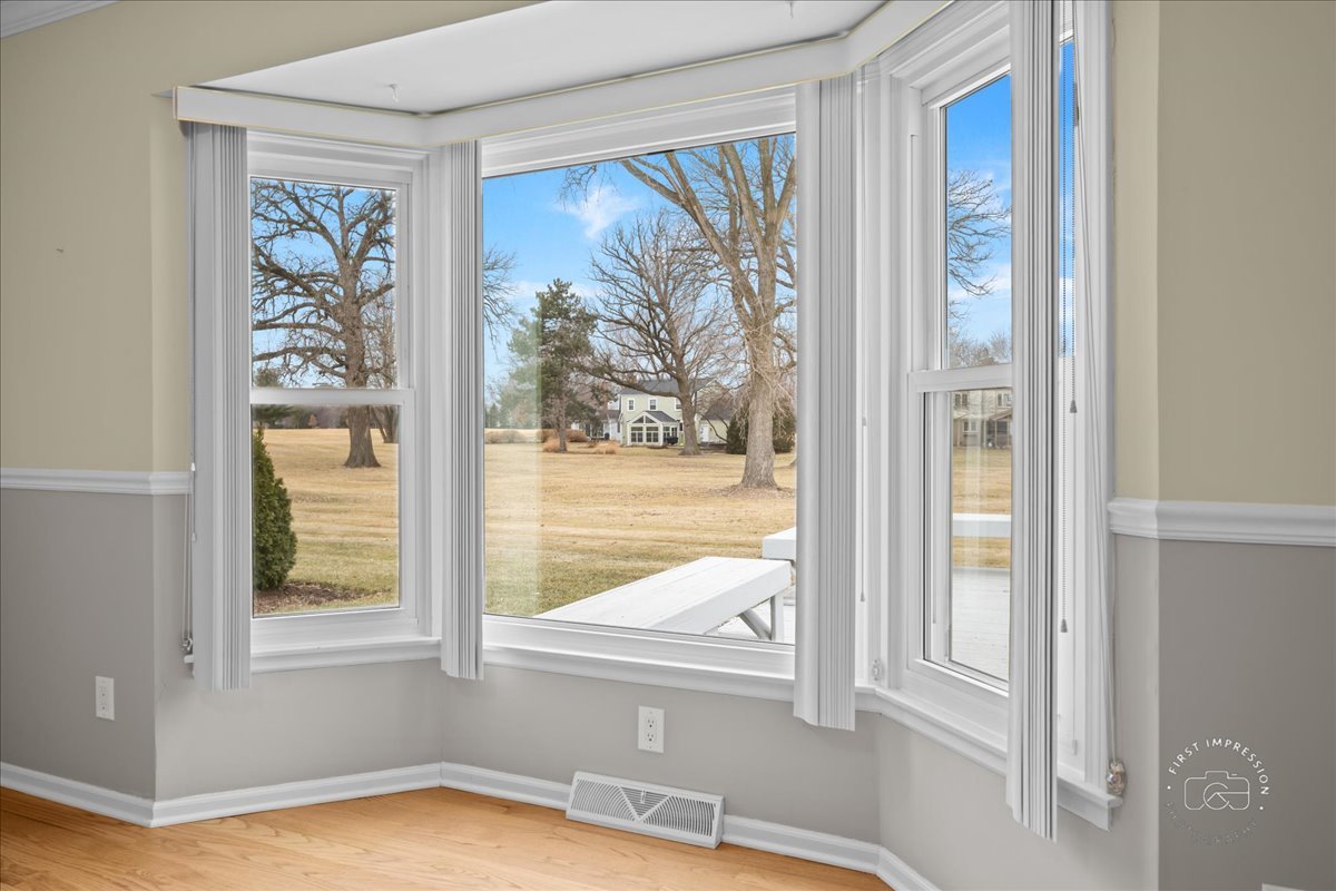32 Dunham Place St. Charles, IL 60174 - Photo 8 of 56 a view of a bedroom with a large window and front door