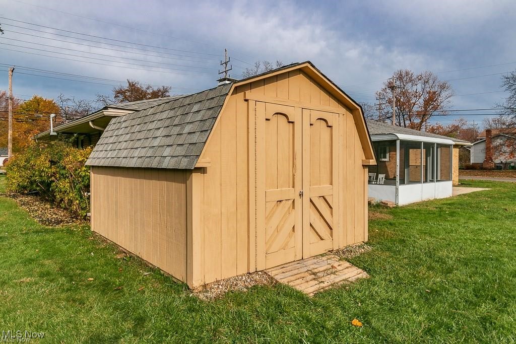 7996 Munson Road Mentor, OH 44060 - Photo 31 of 33 View of outbuilding featuring a lawn