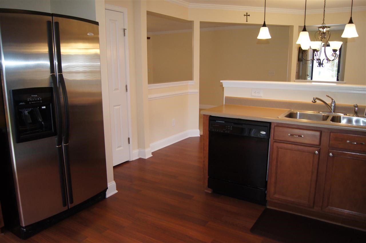 3029 Varcroft Road Knightdale, NC 27545 - Photo 12 of 25 a kitchen with stainless steel appliances granite countertop a refrigerator and a sink