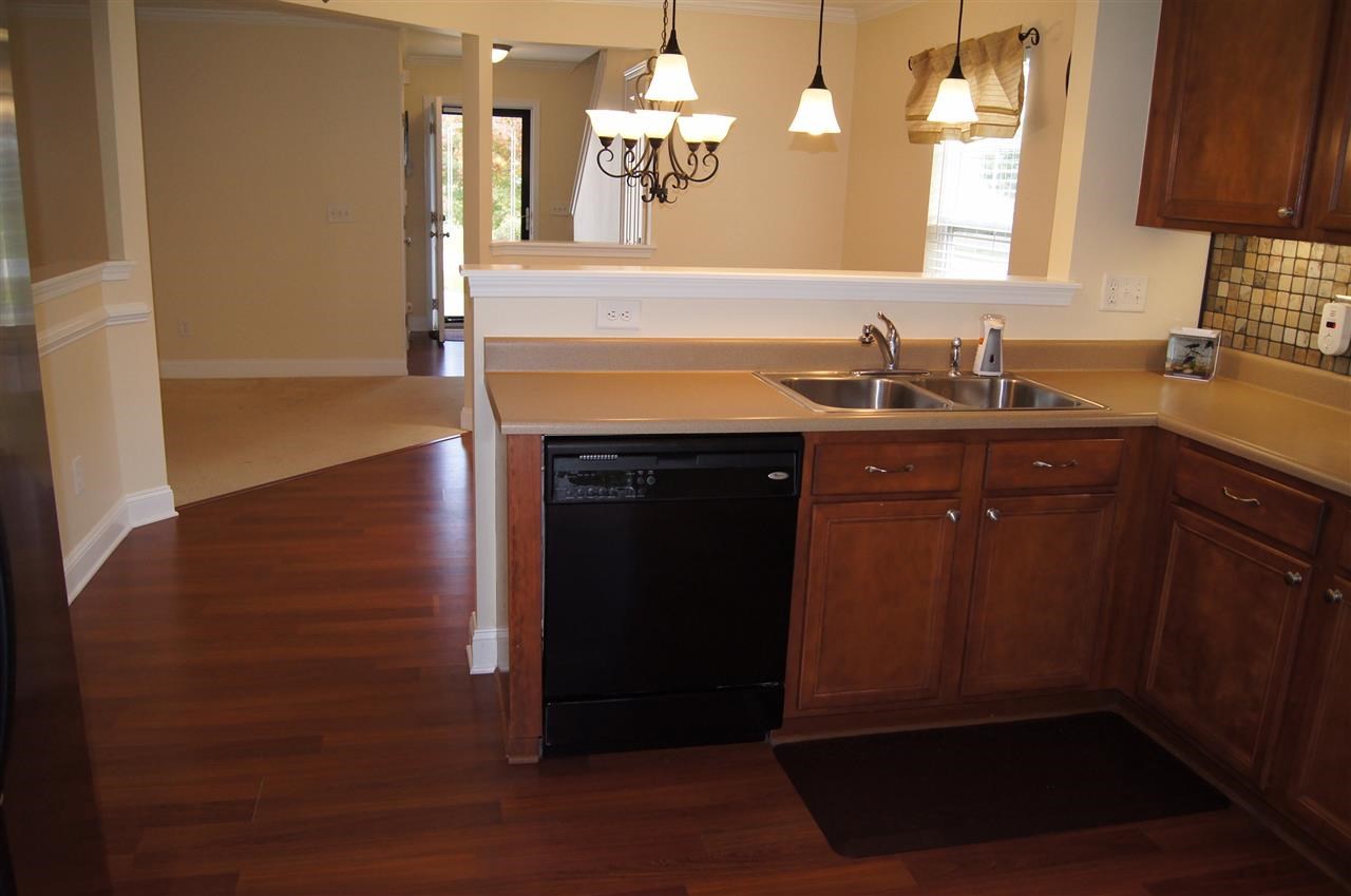 3029 Varcroft Road Knightdale, NC 27545 - Photo 14 of 25 a kitchen with a sink and a mirror
