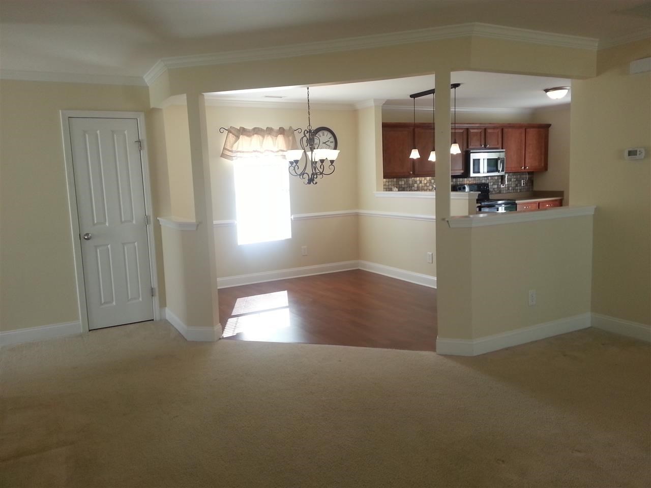 3029 Varcroft Road Knightdale, NC 27545 - Photo 15 of 25 a view of a hallway with dining area