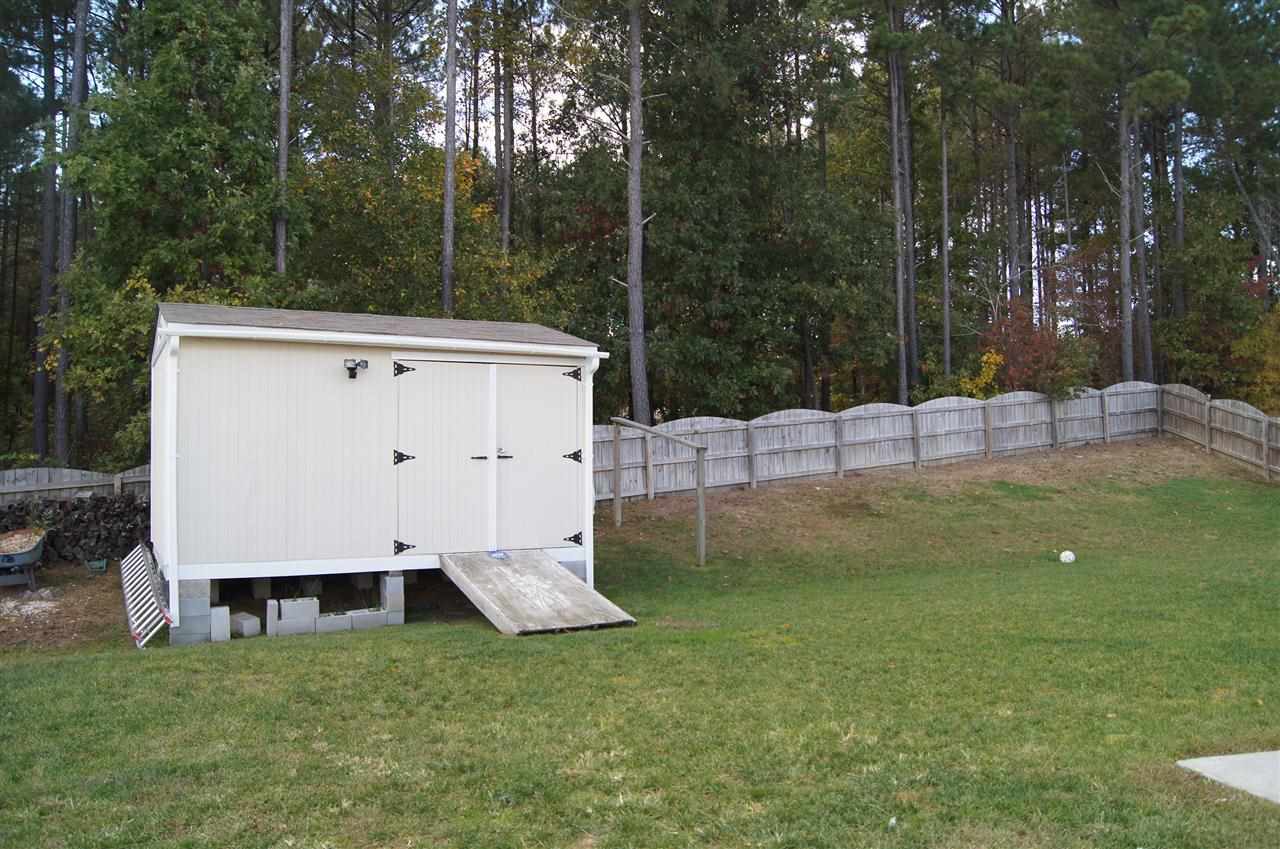3029 Varcroft Road Knightdale, NC 27545 - Photo 2 of 25 a view of a backyard with white house