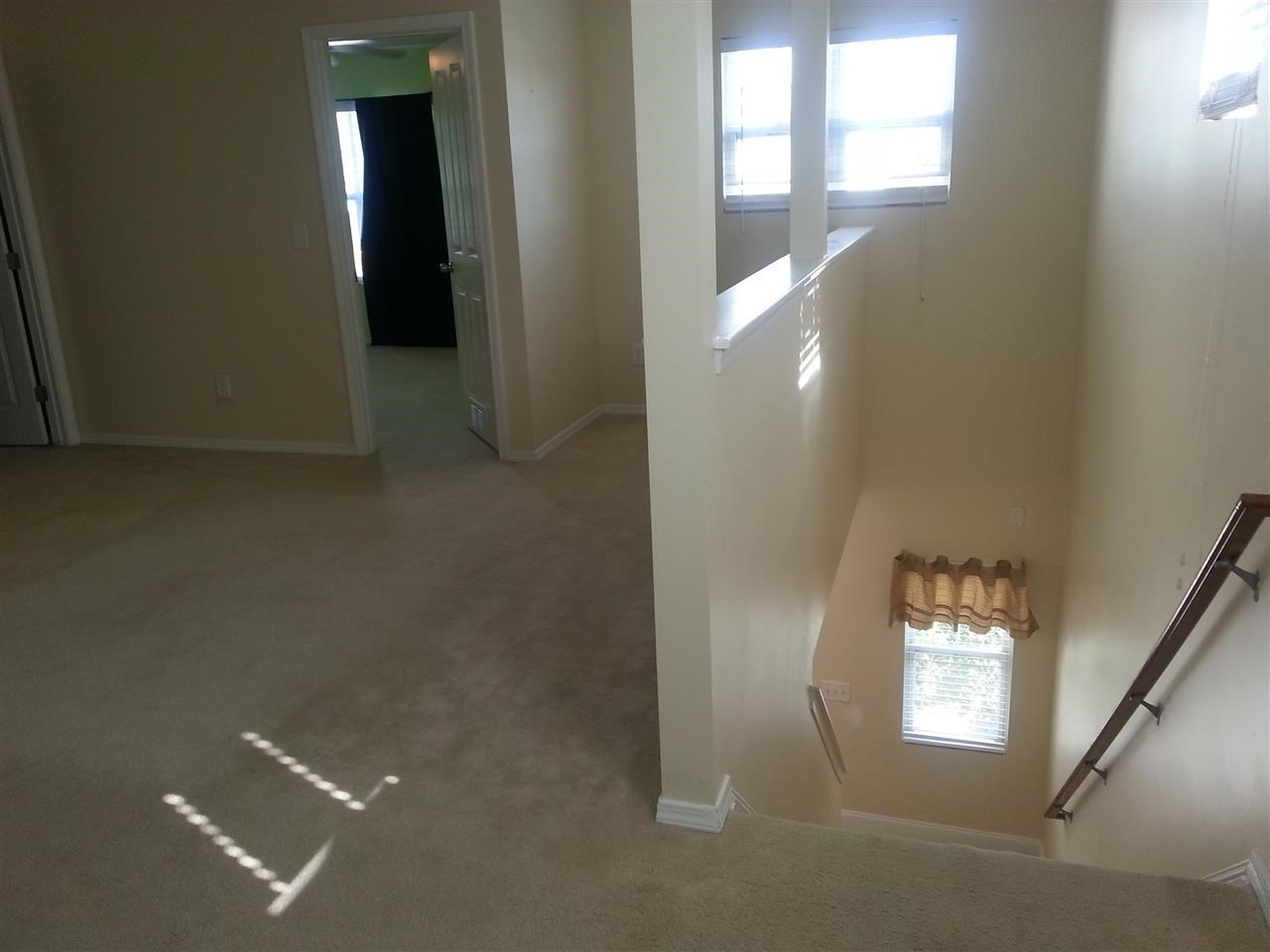 3029 Varcroft Road Knightdale, NC 27545 - Photo 22 of 25 wooden floor in a hall with a window