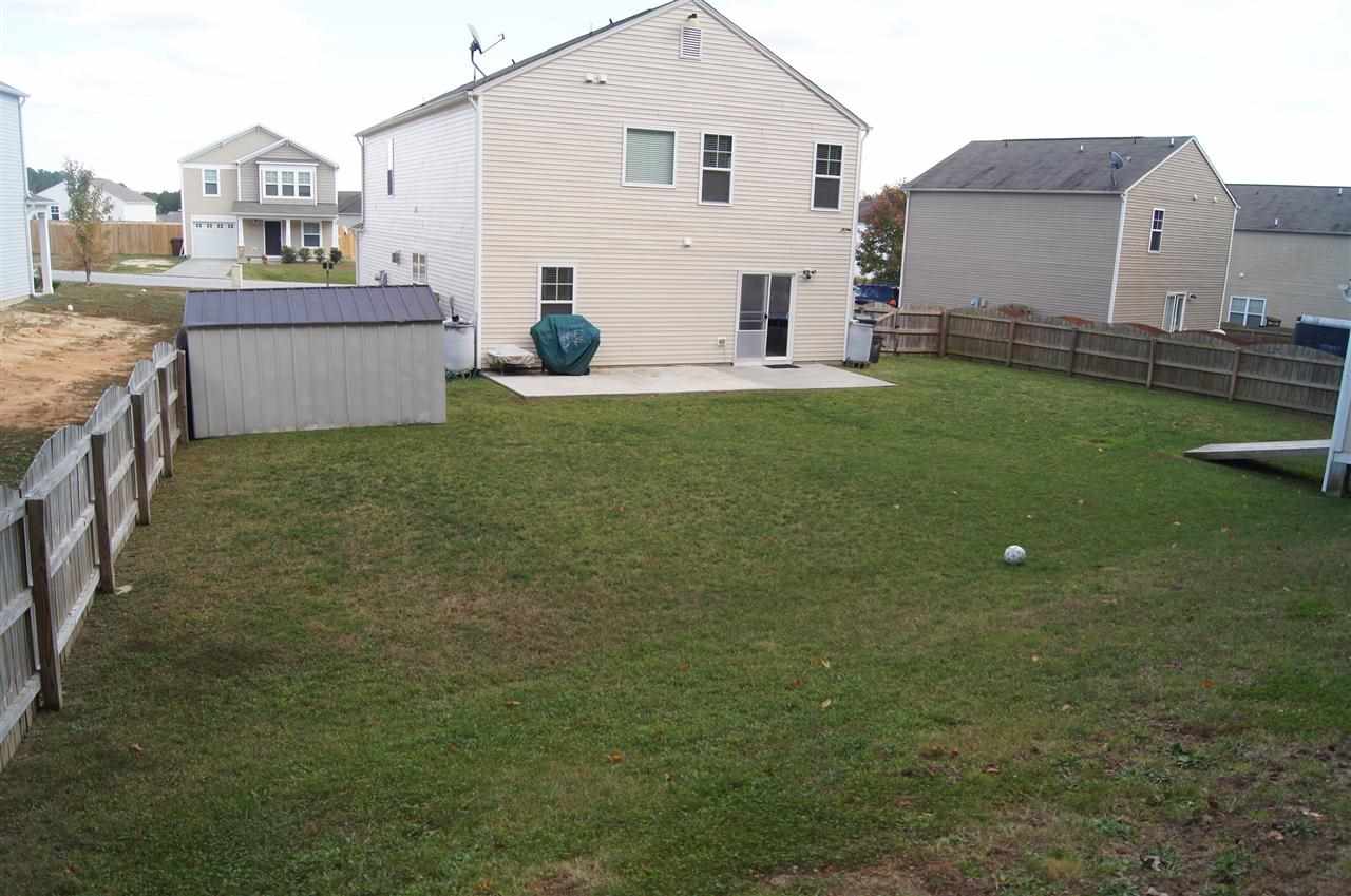3029 Varcroft Road Knightdale, NC 27545 - Photo 24 of 25 a front view of a house with a garden