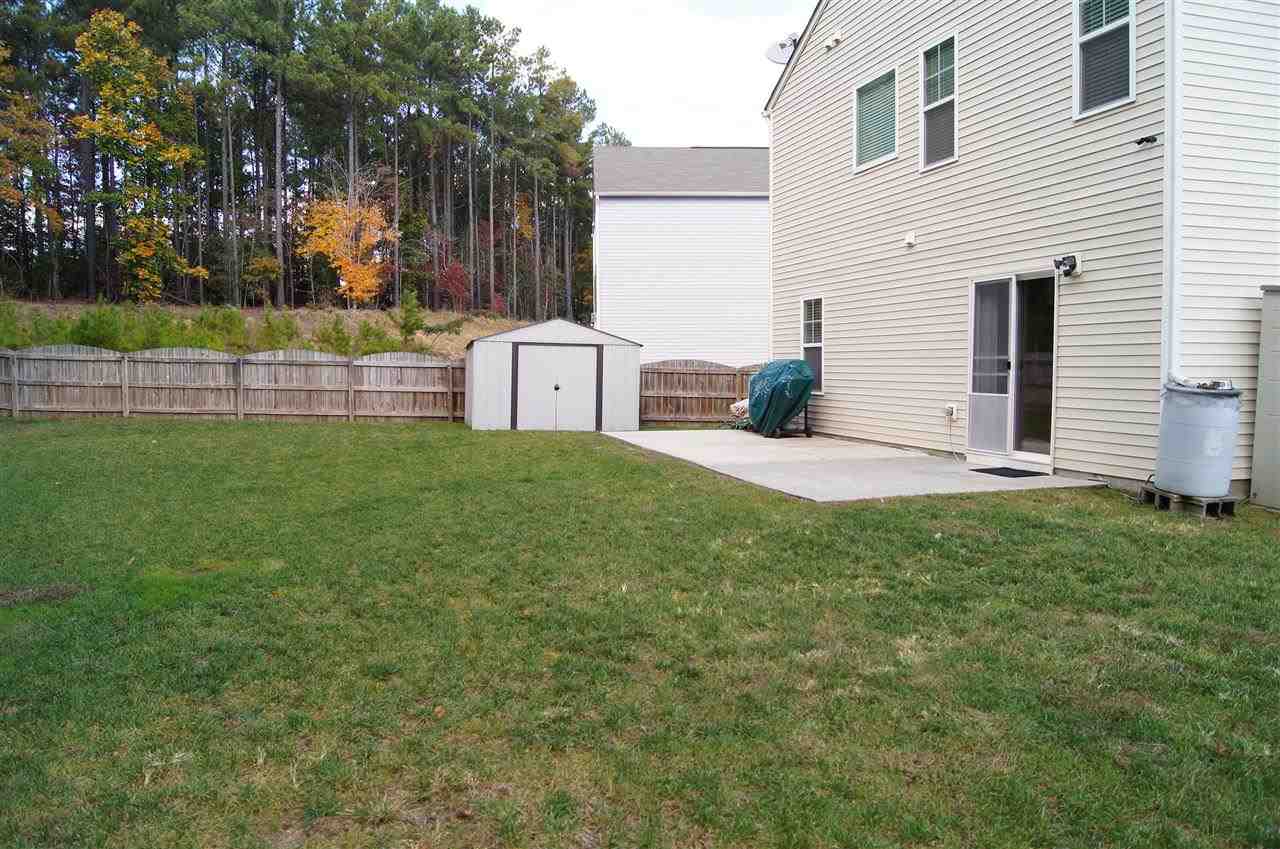 3029 Varcroft Road Knightdale, NC 27545 - Photo 25 of 25 a view of backyard with wooden fence