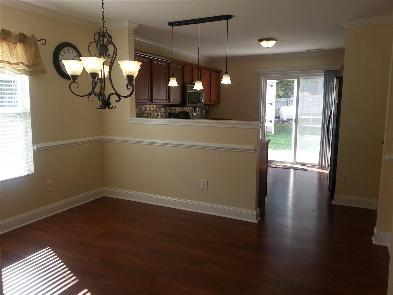 3029 Varcroft Road Knightdale, NC 27545 - Photo 5 of 25 a view of a room with wooden floor and windows