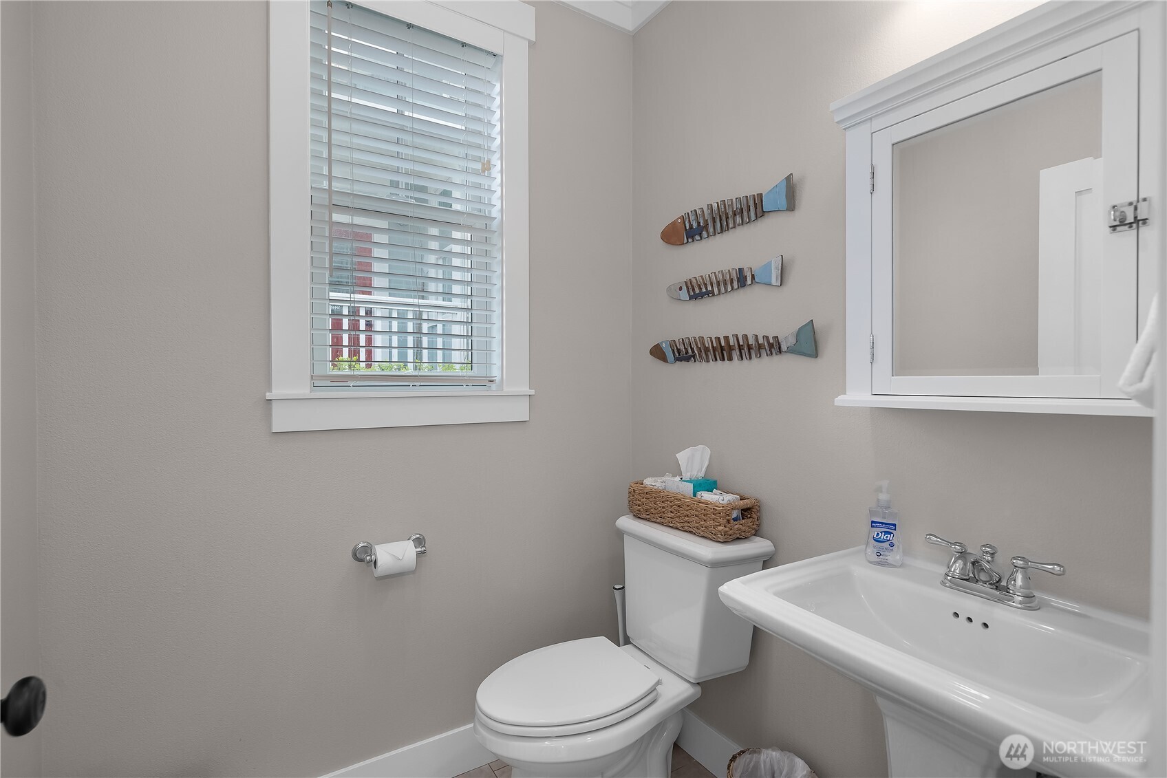 74 Horizon Street Pacific Beach, WA 98571 - Photo 16 of 33 a bathroom with a sink a toilet and a mirror