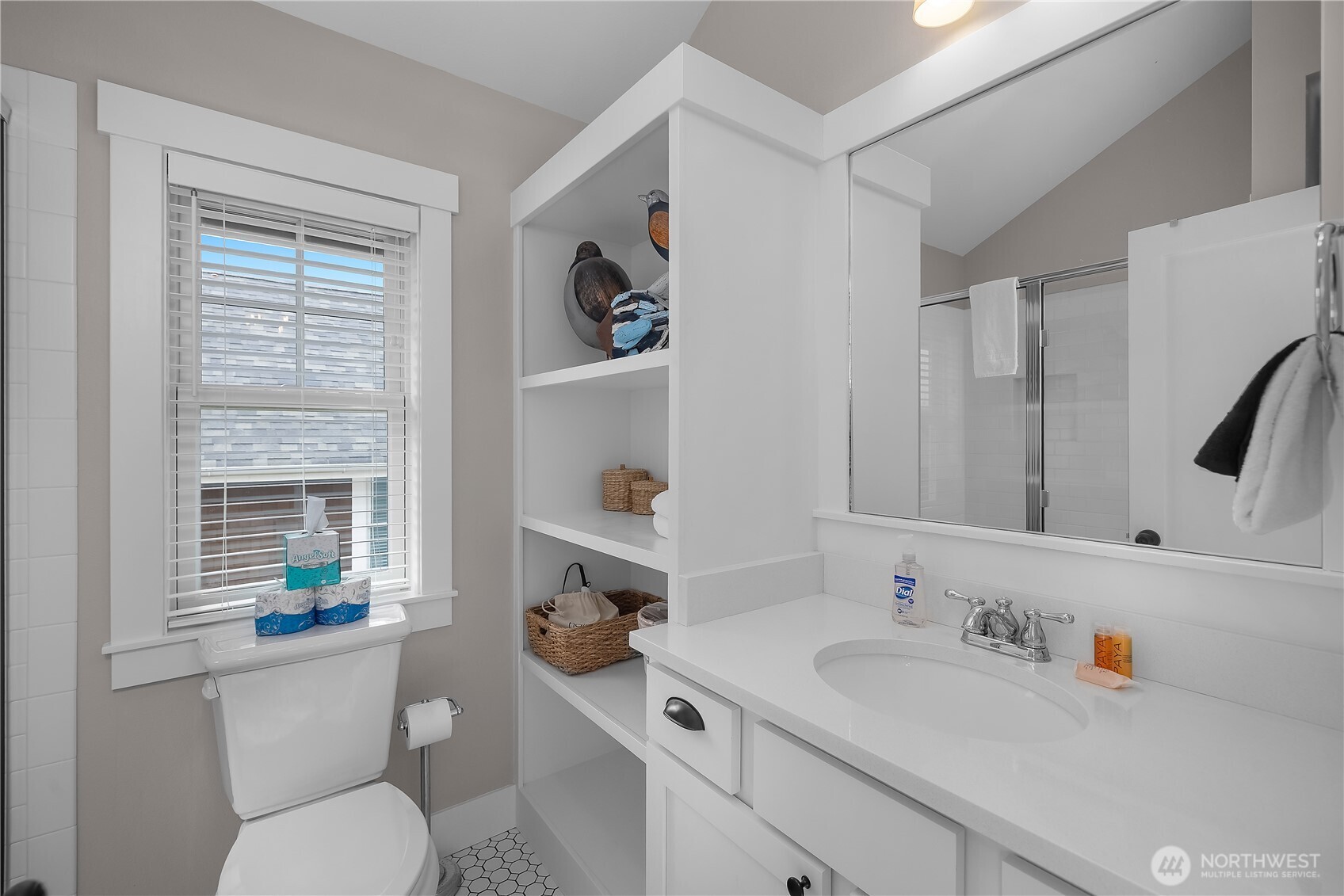 74 Horizon Street Pacific Beach, WA 98571 - Photo 22 of 33 a bathroom with a toilet sink and mirror