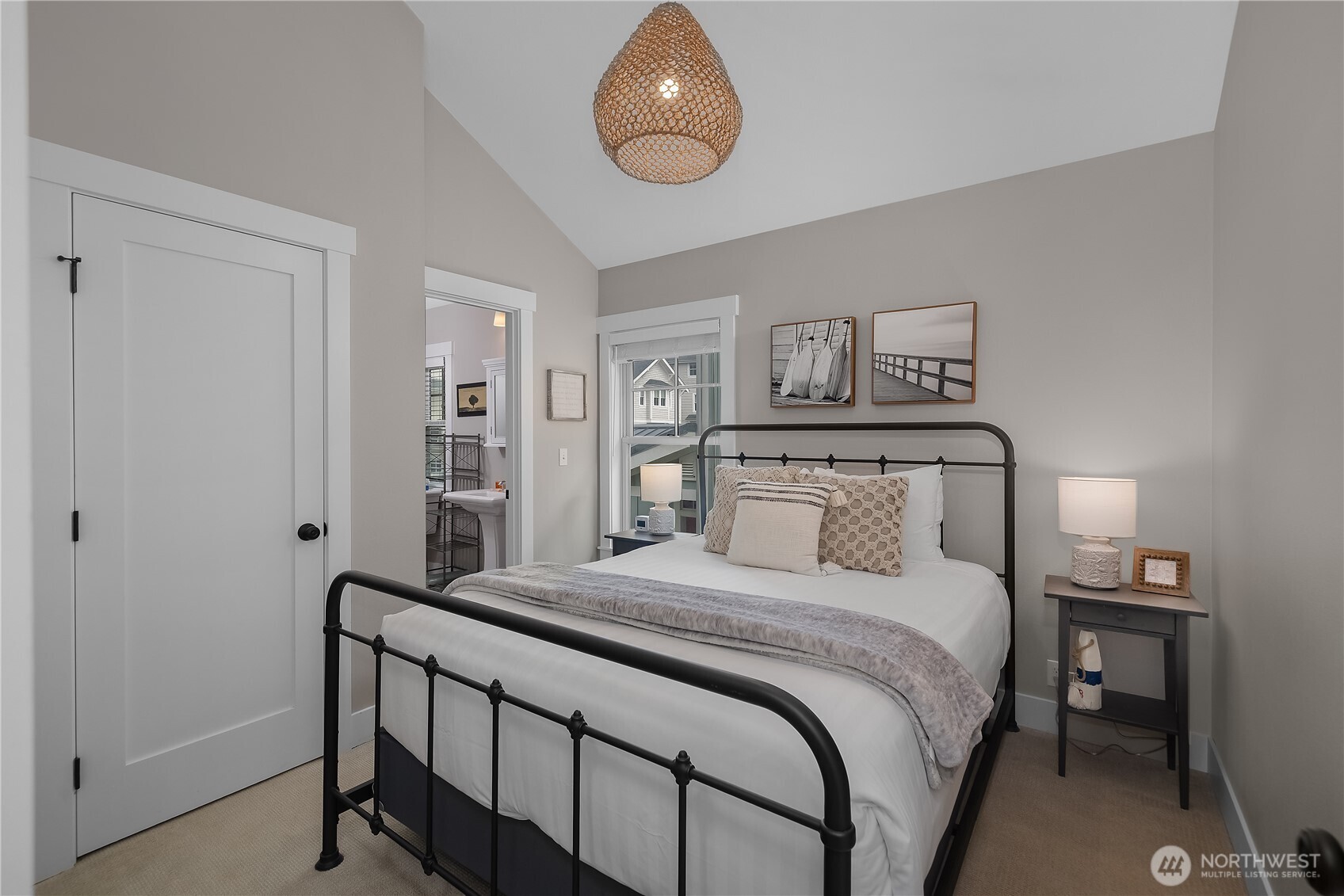 74 Horizon Street Pacific Beach, WA 98571 - Photo 23 of 33 a bedroom with a bed and a chandelier