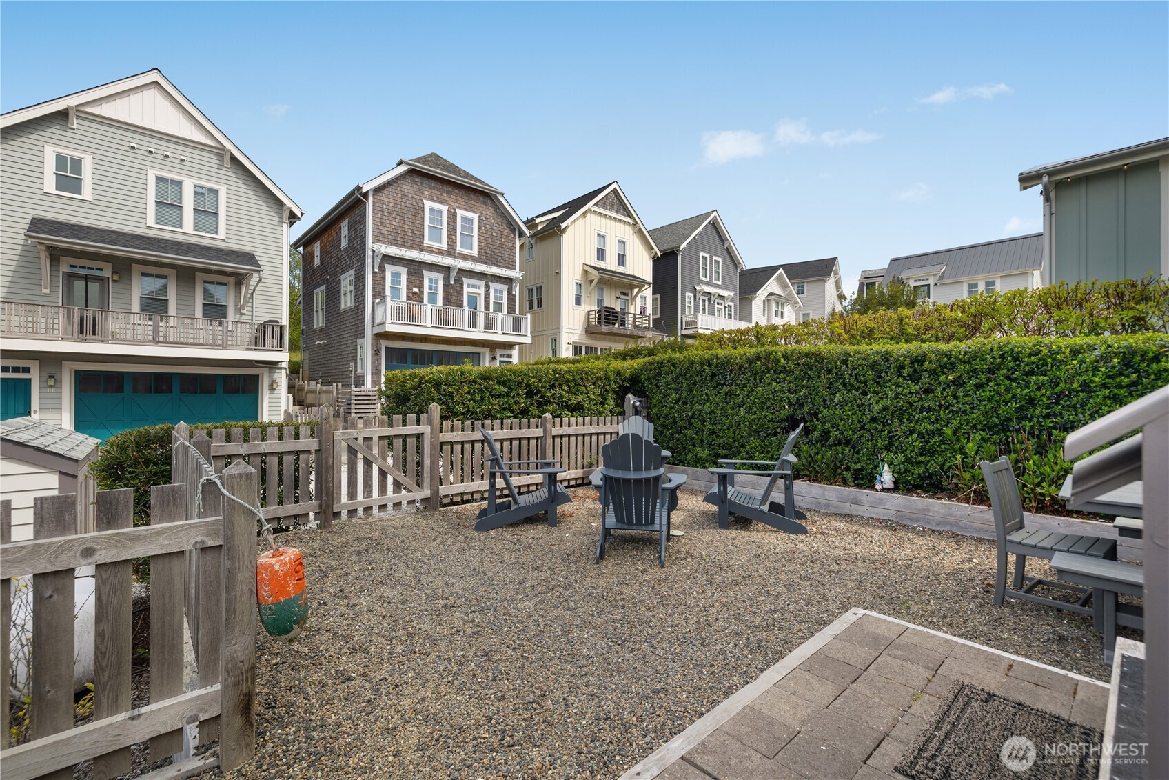 74 Horizon Street Pacific Beach, WA 98571 - Photo 27 of 33 a view of a brick house with a chairs in patio