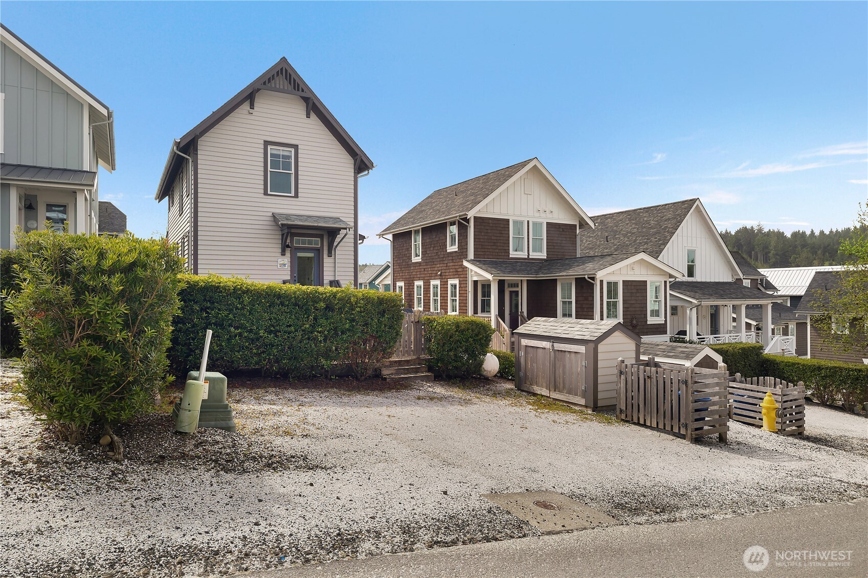 74 Horizon Street Pacific Beach, WA 98571 - Photo 28 of 33 a front view of a house with a yard and garage