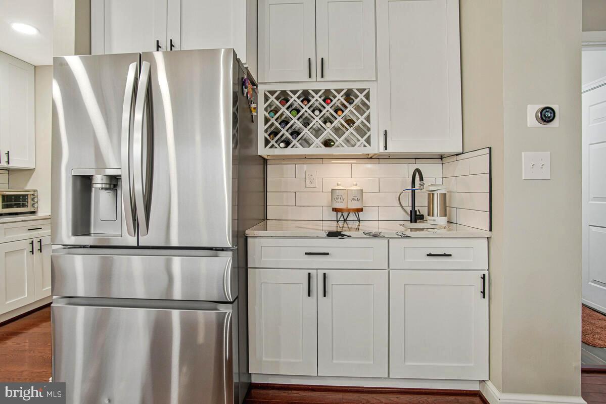 8241 Surratts Road Clinton, MD 20735 - Photo 16 of 55 a kitchen with stainless steel appliances granite countertop a refrigerator and a sink