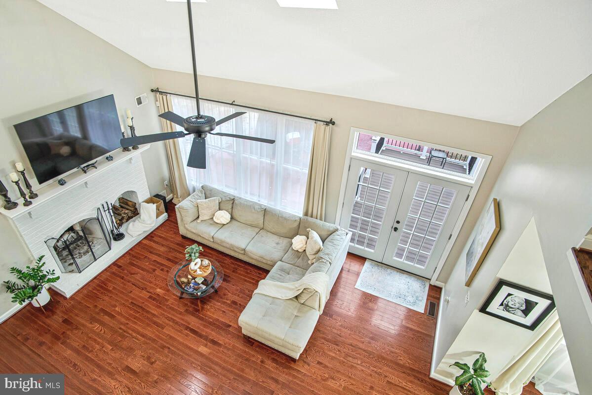 8241 Surratts Road Clinton, MD 20735 - Photo 23 of 55 a living room with furniture and a flat screen tv