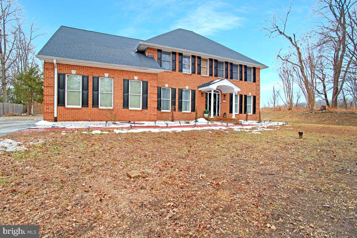 8241 Surratts Road Clinton, MD 20735 - Photo 3 of 55 a front view of a house with a yard