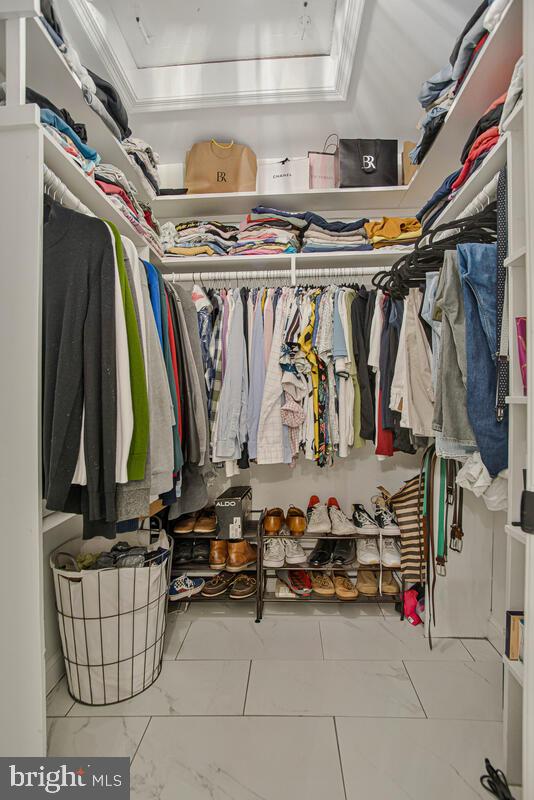 8241 Surratts Road Clinton, MD 20735 - Photo 38 of 55 a view of walk in closet with clothes