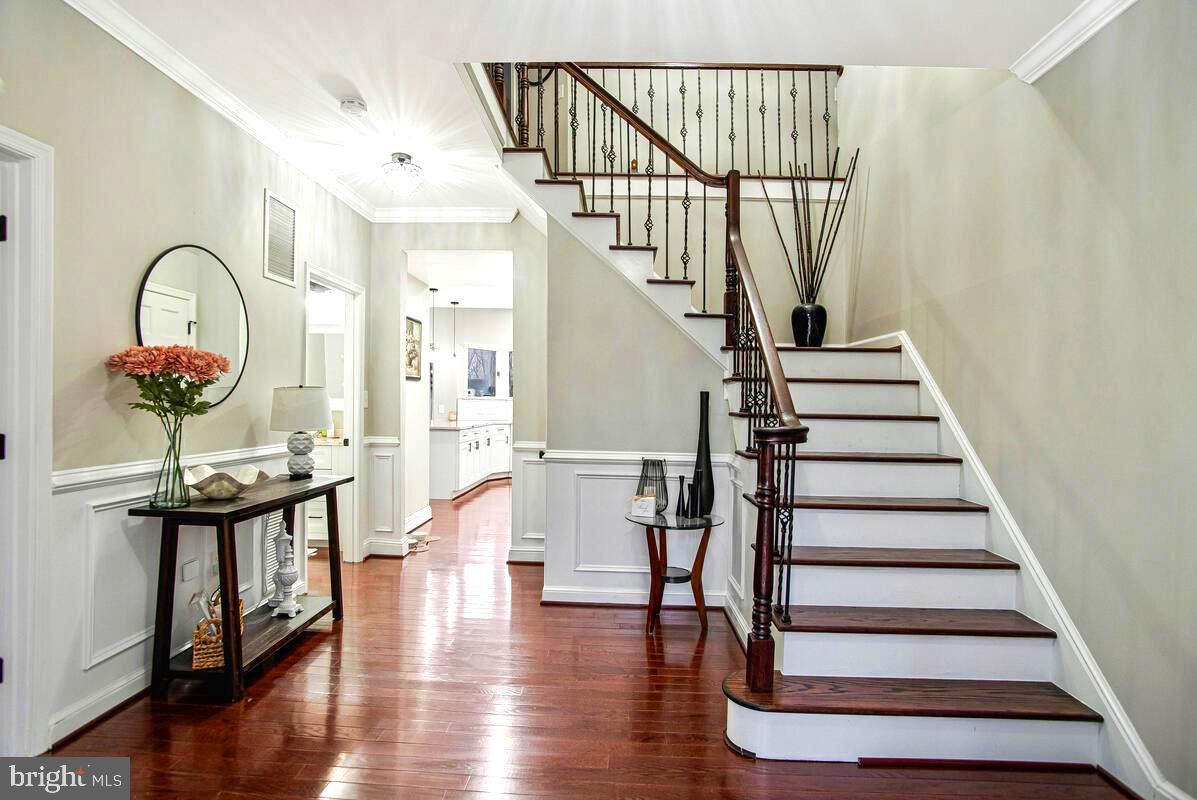 8241 Surratts Road Clinton, MD 20735 - Photo 4 of 55 a view of entryway and hall with wooden floor