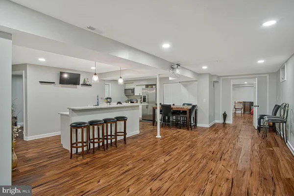 a room with wooden floor and utility