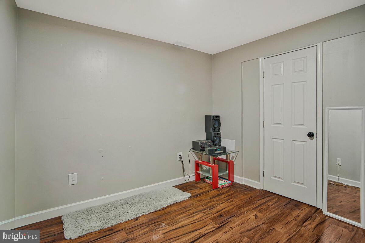 8241 Surratts Road Clinton, MD 20735 - Photo 47 of 55 a view of room with wooden floor and utility room