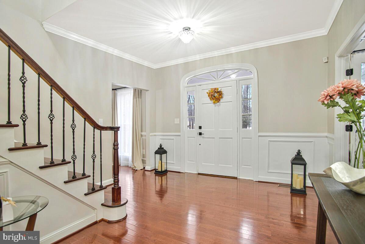 8241 Surratts Road Clinton, MD 20735 - Photo 5 of 55 a view of an entryway with wooden floor and door