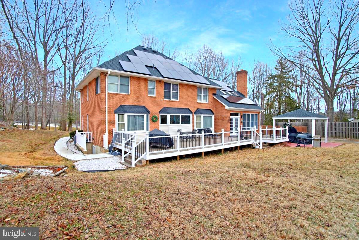 8241 Surratts Road Clinton, MD 20735 - Photo 53 of 55 a view of a house with backyard and sitting area