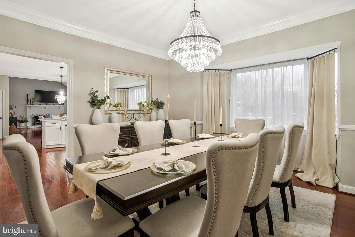 8241 Surratts Road Clinton, MD 20735 - Photo 10 of 55 a view of a dining room with furniture window and wooden floor