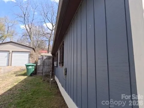 a view of a backyard of the house