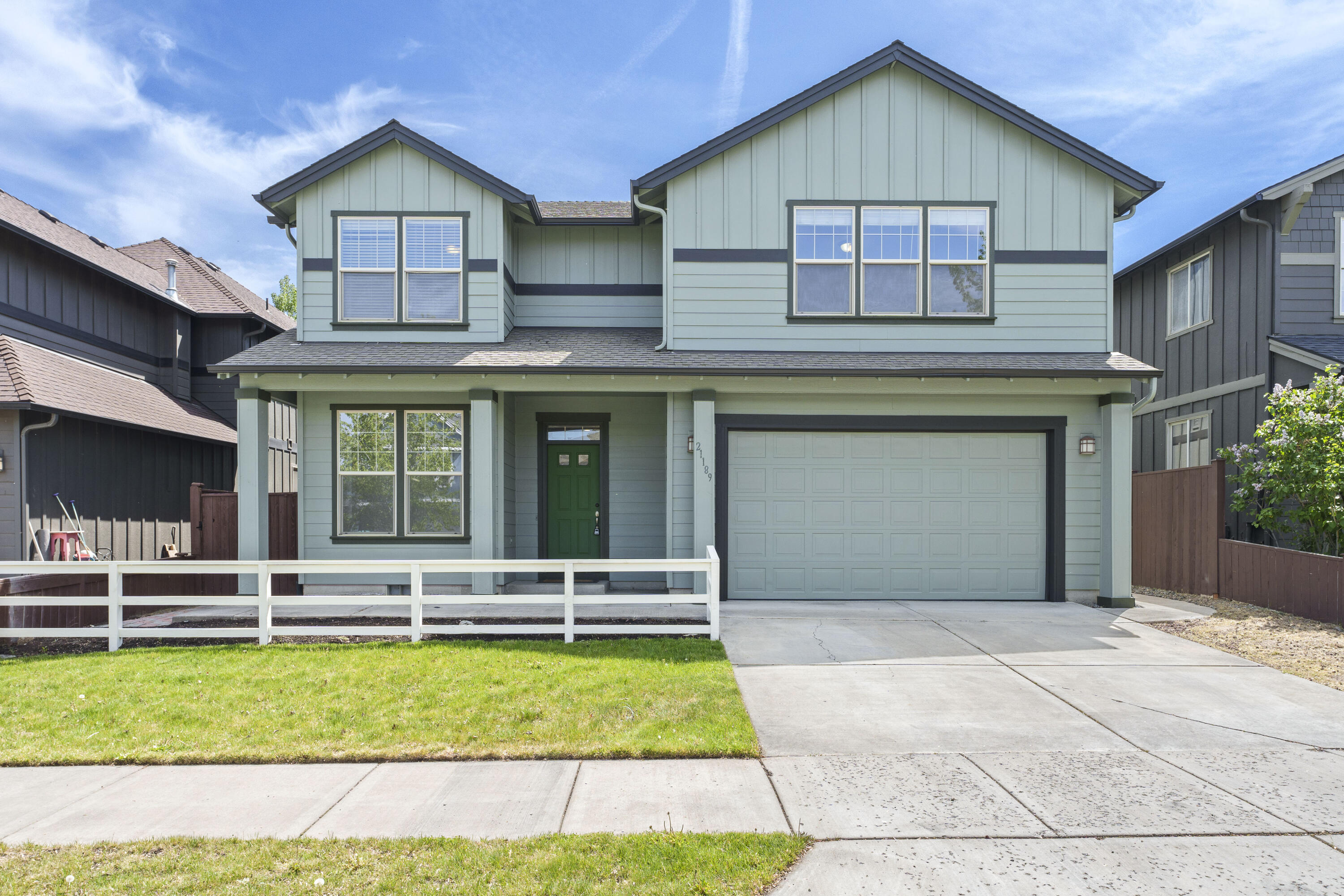 21189 Ritz Place Bend, OR 97702 - Photo 37 of 37 a front view of a house with a yard and garage