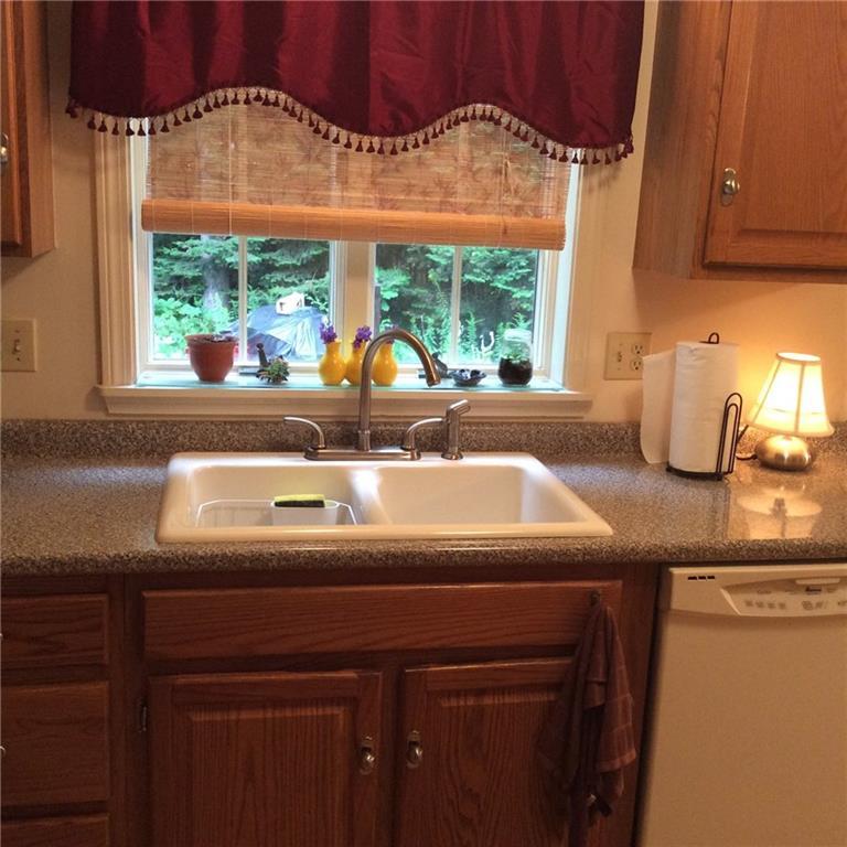 5 Meagans Way, Unit 5 Windham, ME 04062 - Photo 4 of 18 sink with backyard view