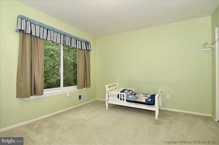 10911 Knights Bridge Court Reston, VA 20190 - Photo 2 of 30 a view of an empty room with a window