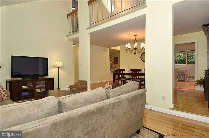 10911 Knights Bridge Court Reston, VA 20190 - Photo 14 of 30 a living room with furniture and a flat screen tv