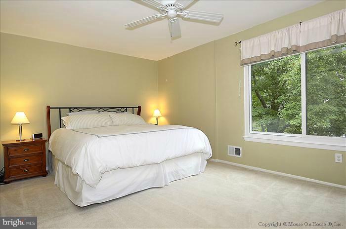 10911 Knights Bridge Court Reston, VA 20190 - Photo 16 of 30 a bedroom with a bed and window