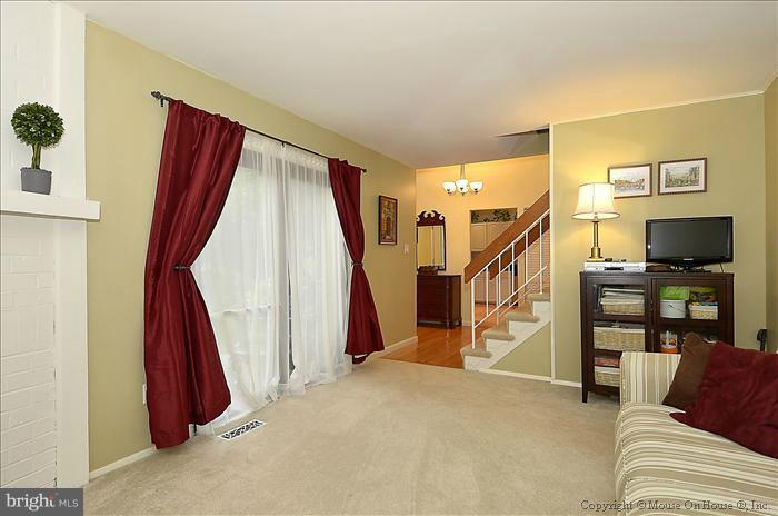 10911 Knights Bridge Court Reston, VA 20190 - Photo 27 of 30 a view of a livingroom with furniture and stairs
