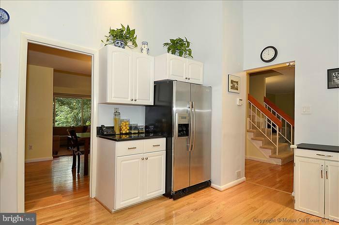 10911 Knights Bridge Court Reston, VA 20190 - Photo 6 of 30 a kitchen with a refrigerator and a stove