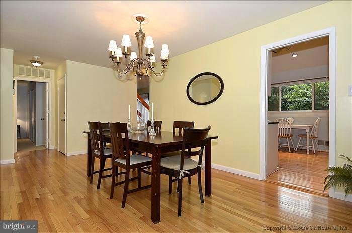 10911 Knights Bridge Court Reston, VA 20190 - Photo 7 of 30 a view of a dining room with furniture and wooden floor