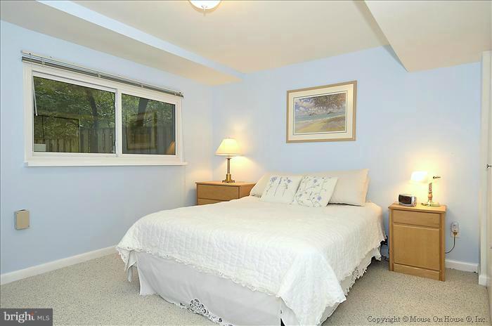 10911 Knights Bridge Court Reston, VA 20190 - Photo 10 of 30 a bedroom with a bed and a window