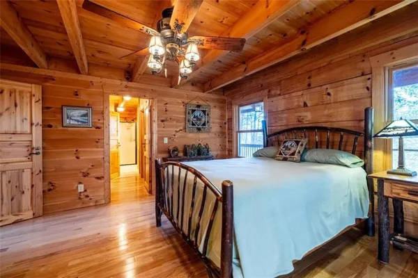 a bedroom with furniture and a chandelier