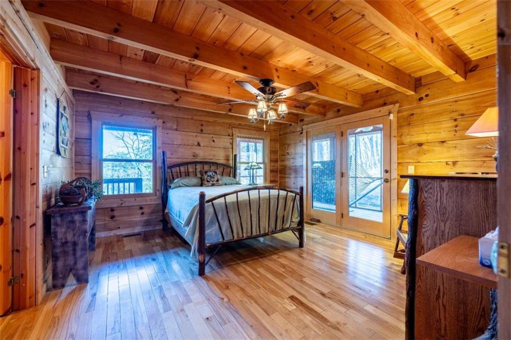 2077 Big Texas Valley Road Northwest Rome, GA 30165 - Photo 14 of 42 a bedroom with a bed and wooden floor